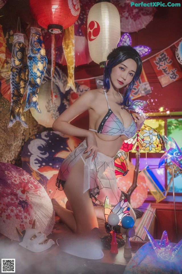 A woman in a bikini posing for a picture.
