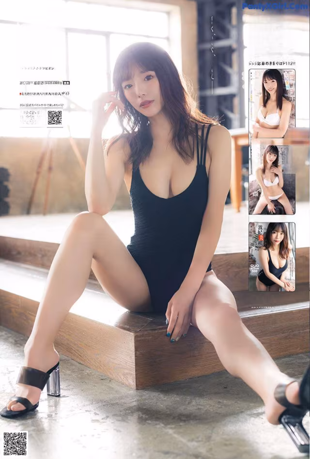 A woman in a black bathing suit sitting on a wooden bench.